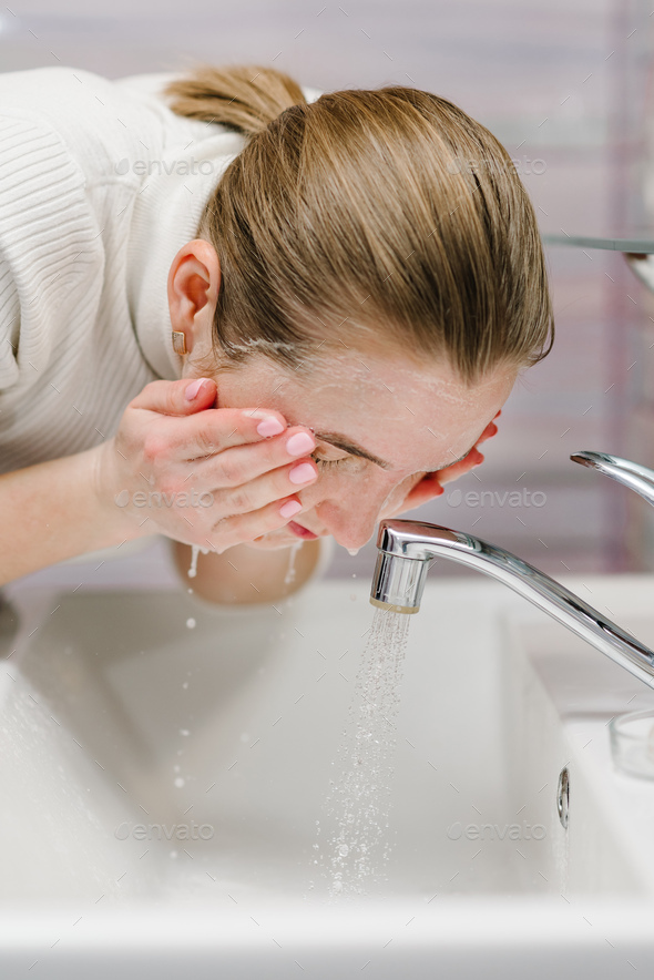 wash face with antibacterial soap and running water in sink epidemic